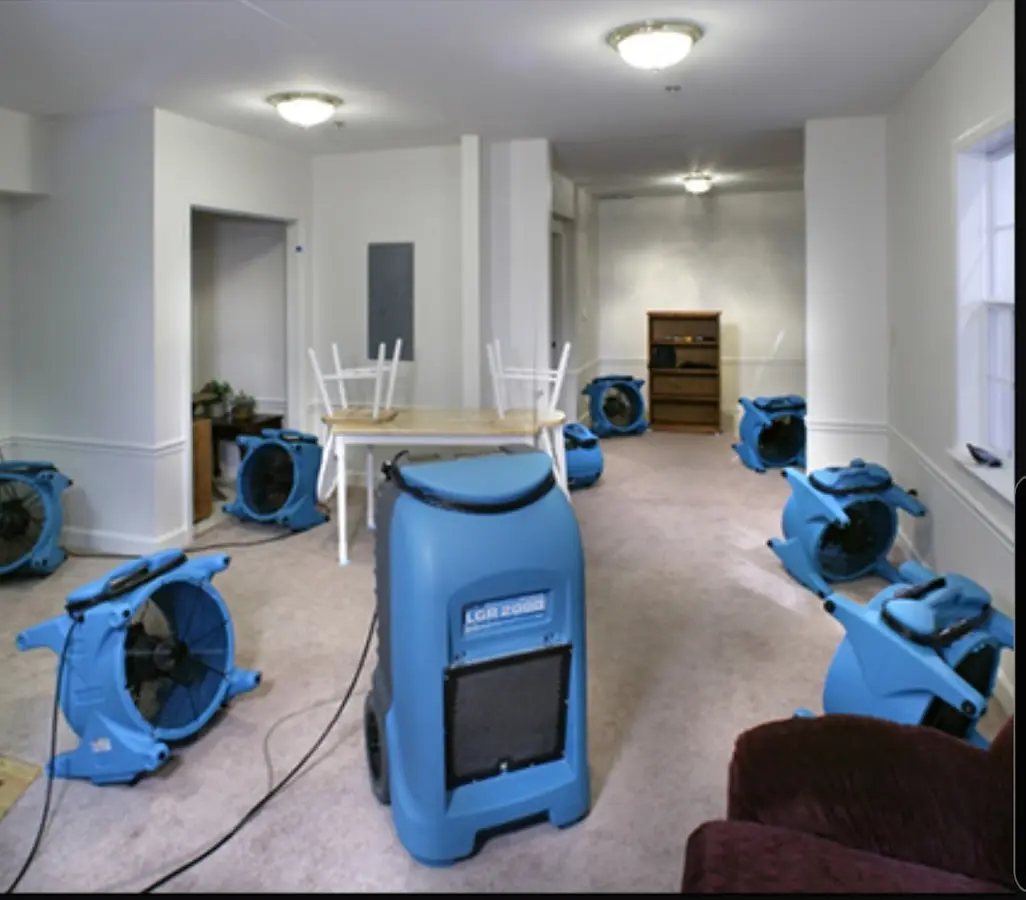 Air movers and dehumidifier setup for Water Damage Restoration in Center