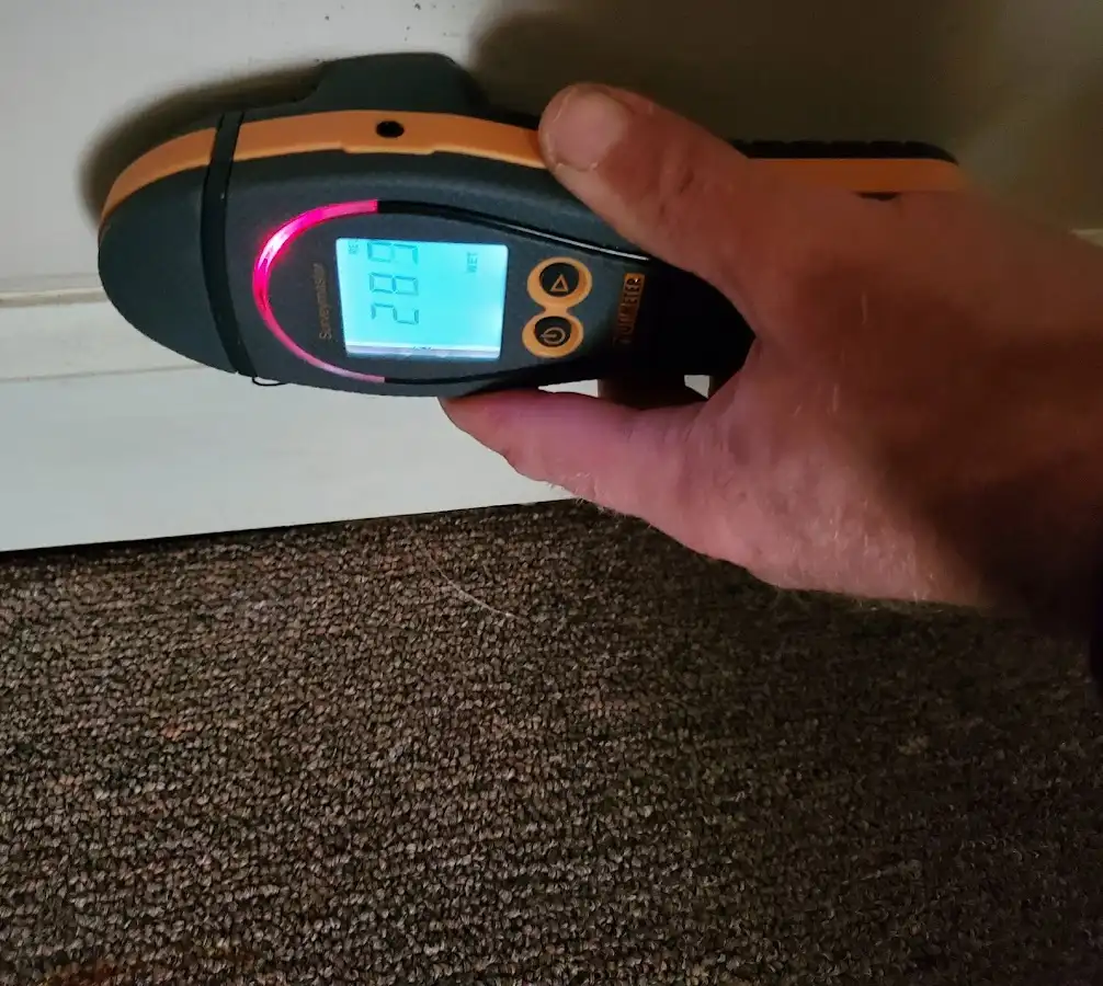Moisture detection at baseboard during Sewage Cleanup & Sanitation in Center